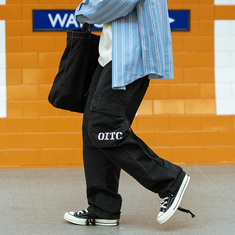 Wholesale autumn trendy men cotton vintage wide leg multi-pockets functional ribbon trim oversized baggy cargo pants