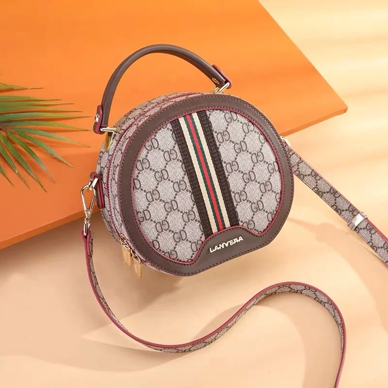 
2019 new fashion ladies trend printing retro portable slung small round bag 