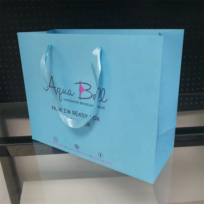 Custom White Craft Paper Bag With Logo Print Wholesale Packing Shipping Paper Bags Ribbon Handle Paper Tag For Clothes Store