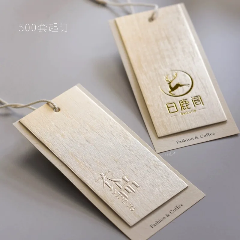 Luxury Custom Logo 500g Brushed Light Gold Special Paper Embossed Swing Tag Clothes Label Hang Tags