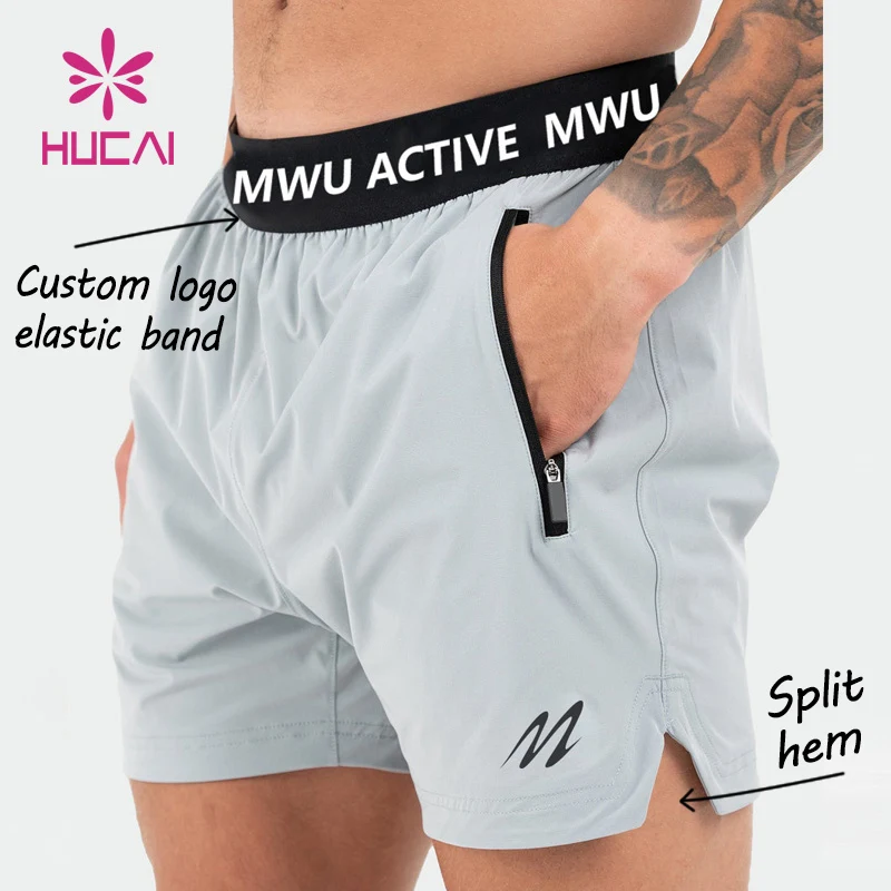 Custom logo on waistband polyester pockets Split hem pour hommes sports active mens workout gym Athletic shorts for men