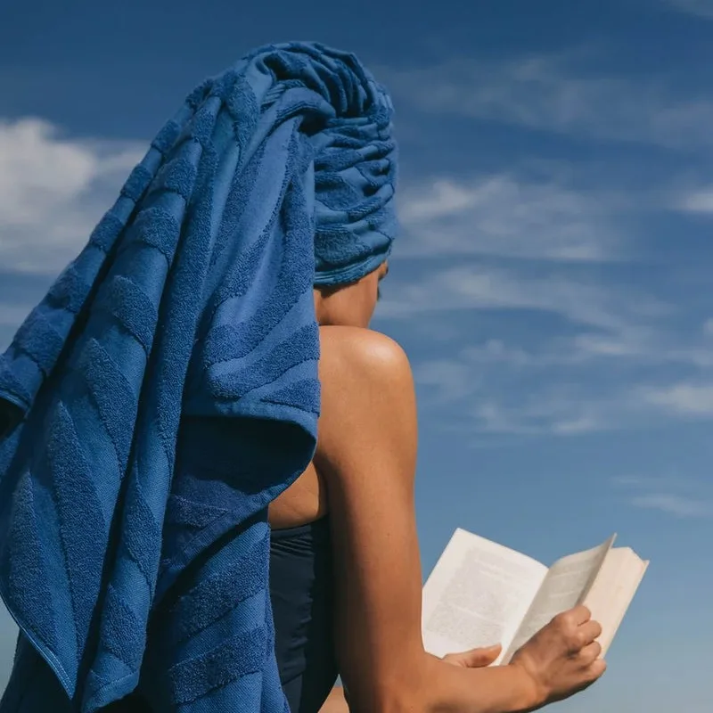 Embossed cotton beach towel with jacquard logo