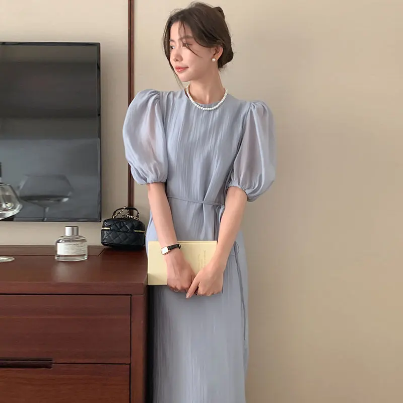 Wholesale 2023 South Korea Soft Green Round Neck Hollow-out Backless Lace Up Waist Solid Color Bubble Sleeve Dress