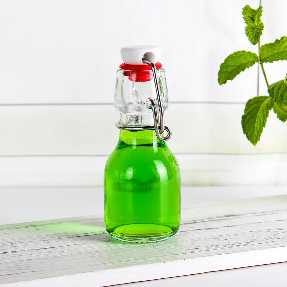 Wholesale popular UK 50ml Swing Top Drinking Water Empty Transparent Beverage Juice Coffee Milk Tea Glass Bottle In Stock