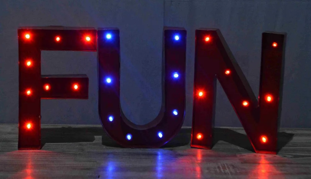 Decorative standing metal letters with lighted H letter