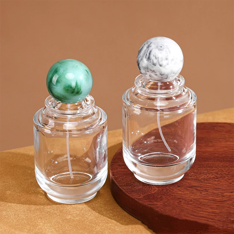 Luxury 100ml Round Cylinder Transparent Spray Glass Perfume Bottle Empty Unique Press Type Perfume Bottles With Resin Ball Caps