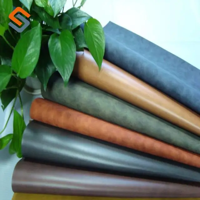 Hot Engraved Embossed Technology Pressure Change PU Leather for Jeans Label