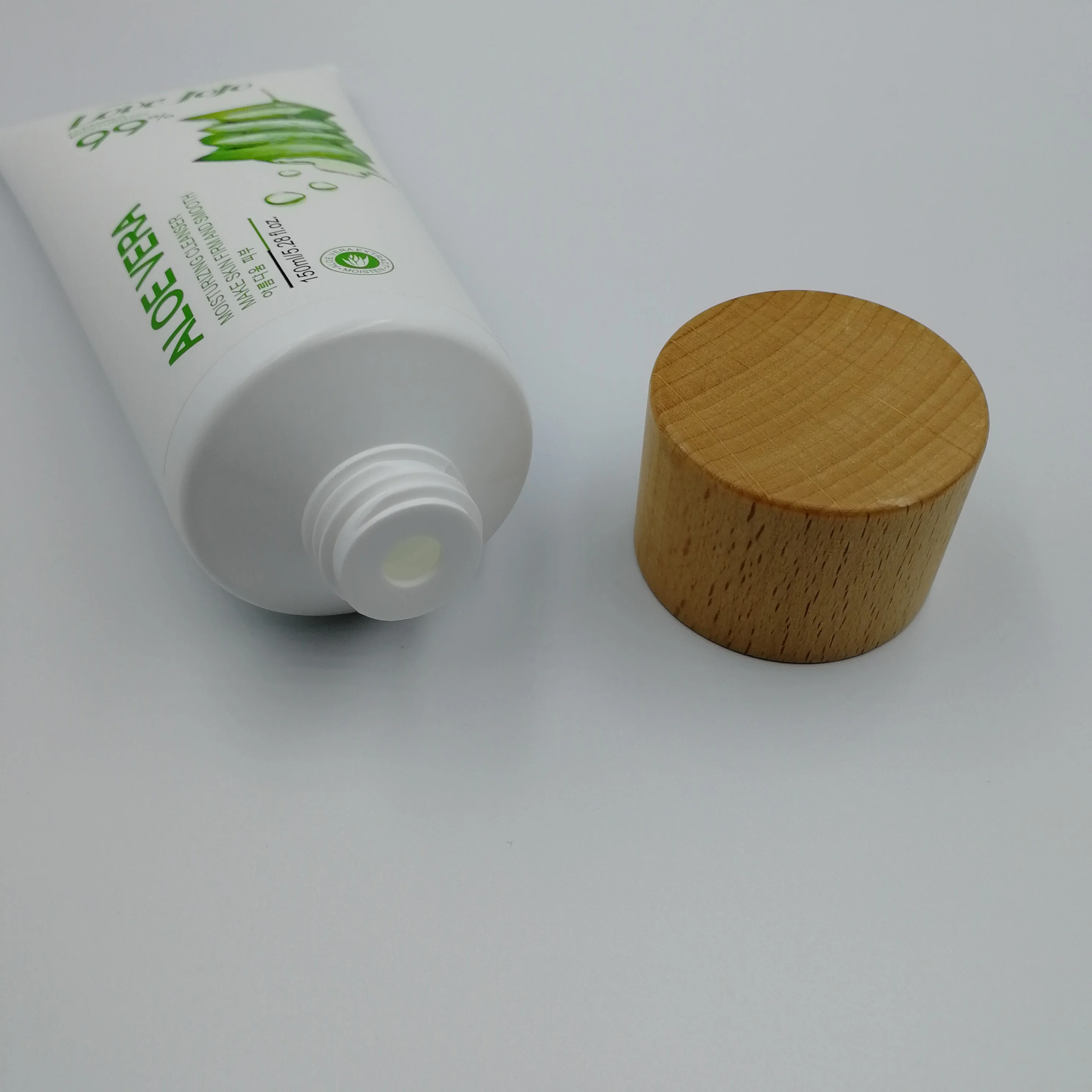 
40g-150g high quality cosmetic packaging soft tube PE squeeze tube wooden screw cap for skin care facial cleanser 