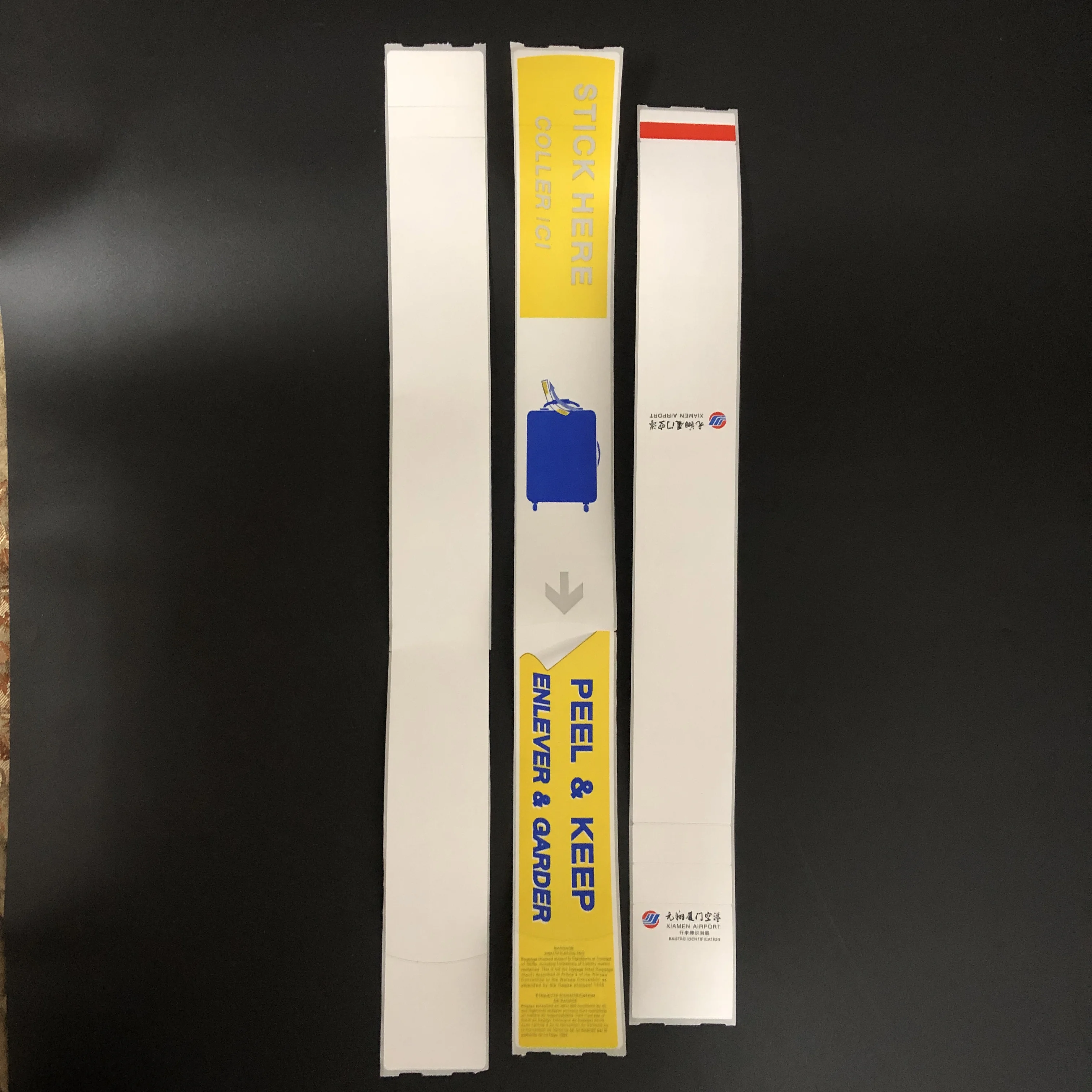 Customized cheap blank thermal adhesive luggage claim tags on roll taggage cliam sticker tags