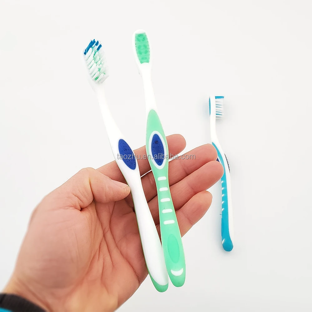 Gum Massage Toothbrush with rubber sticks among bristles