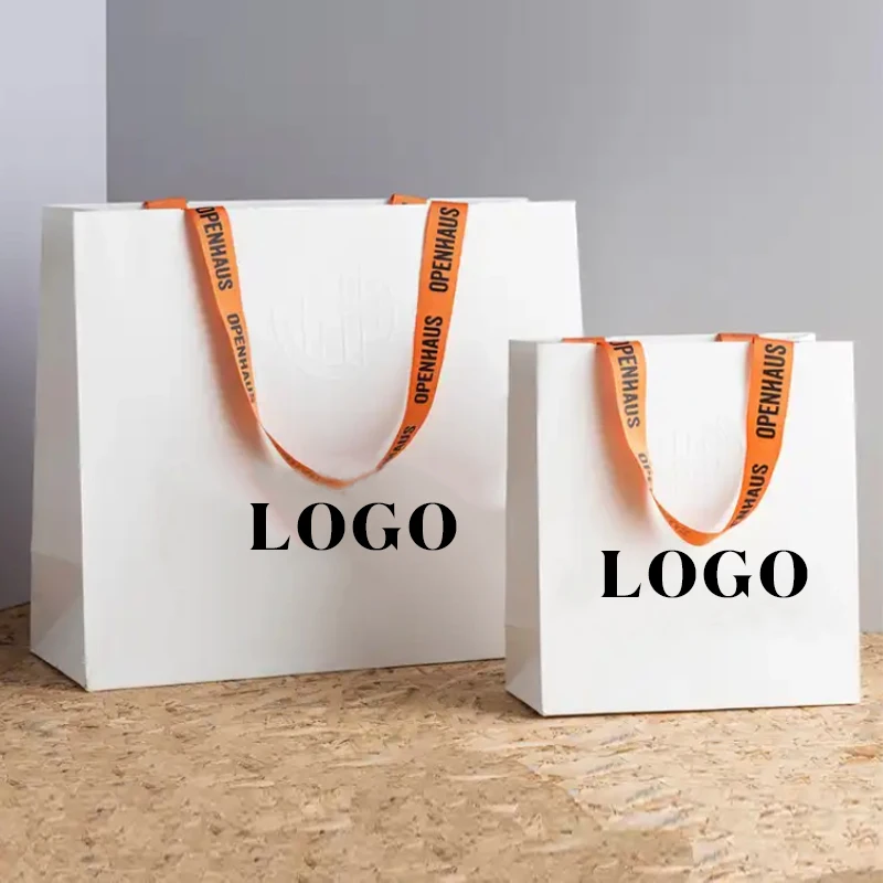 Factory wholesale custom printed brand logo bow tie design promotion luxury clothing gift shopping paper bag with handle