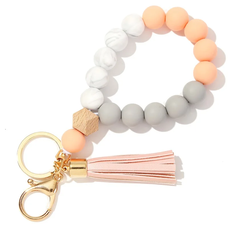 2023 Wholesale New Food Grade Silicone Beads Keychain Bracelet Wooden Bead Key Ring Wristlet With PU Tassel