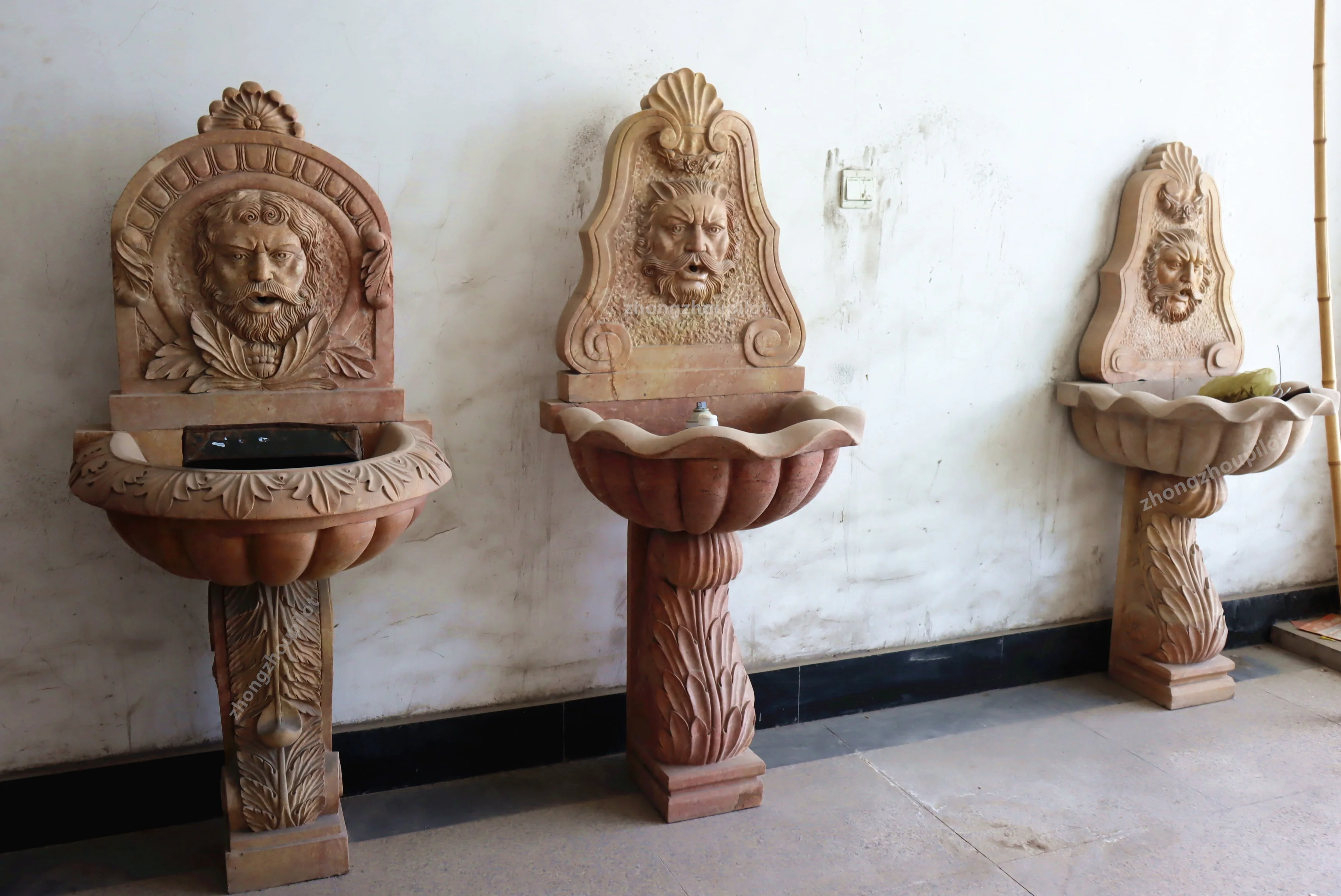 Indoor and outdoor red and beige stone small waterfall wall man head water fountain