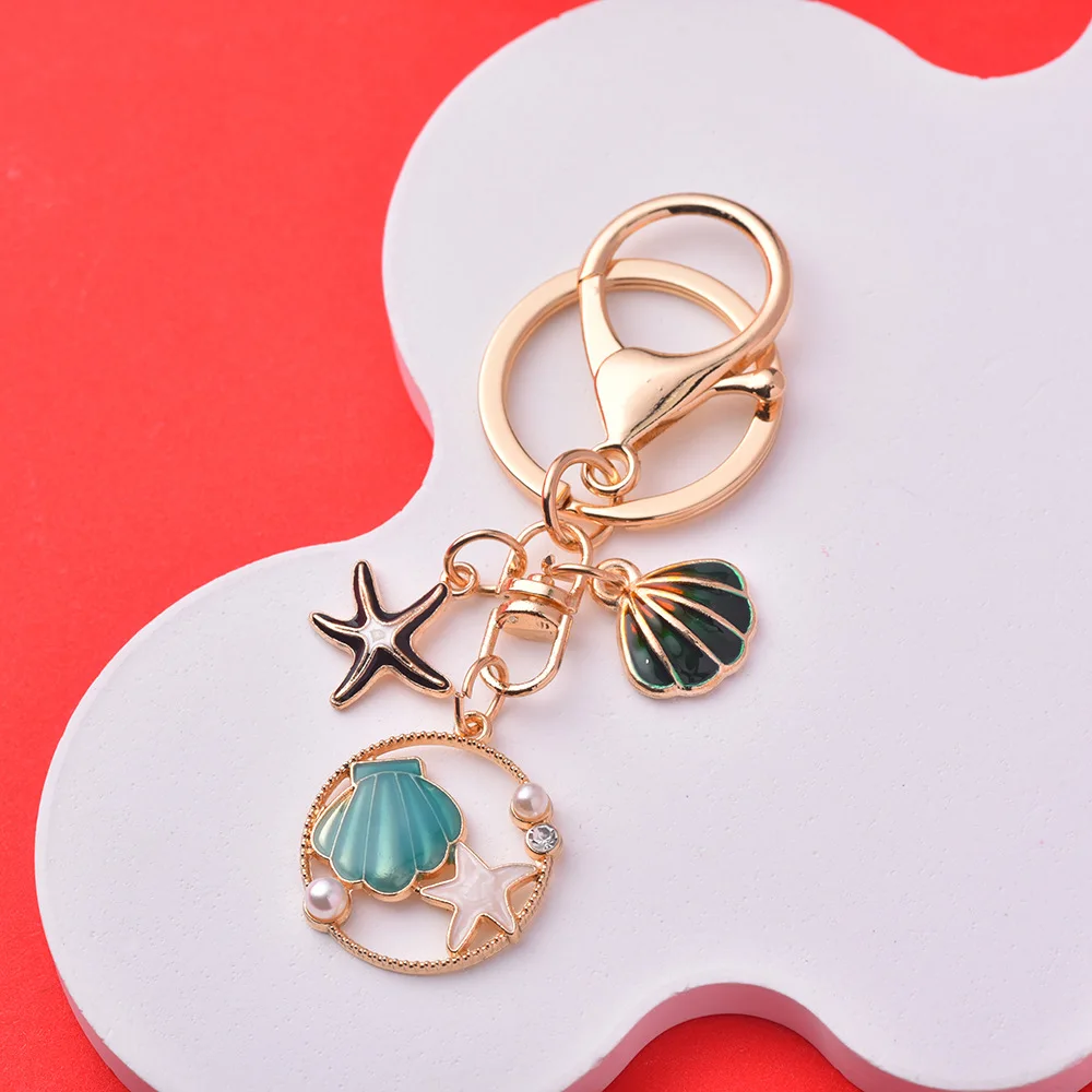Xinxing Ocean Wind Imitation Pearl Shell Starfish Keychain Alloy Material Drop Glaze Craft Women Bag Pendant Colour Key Chain