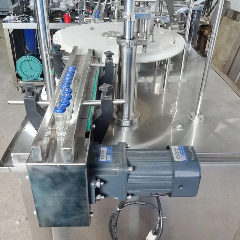 China Manufacturer Rotary Medicine Liquid Bottling Automatic Vial Filling Capping Machine and Labeling