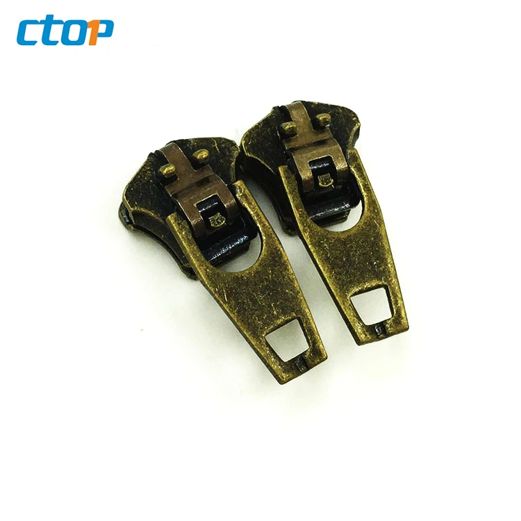 Wholesale YG brass spring lock sliders zipper puller zipper head custom jeans zipper slider