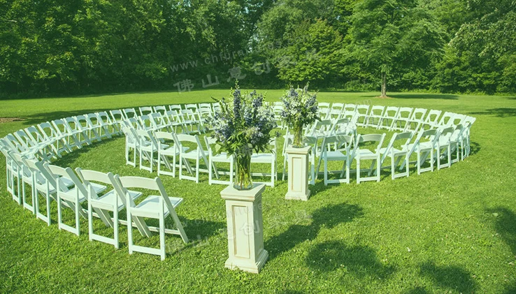 New design modern outdoor white foldable and stackable plastic resin fancy event wedding chairs