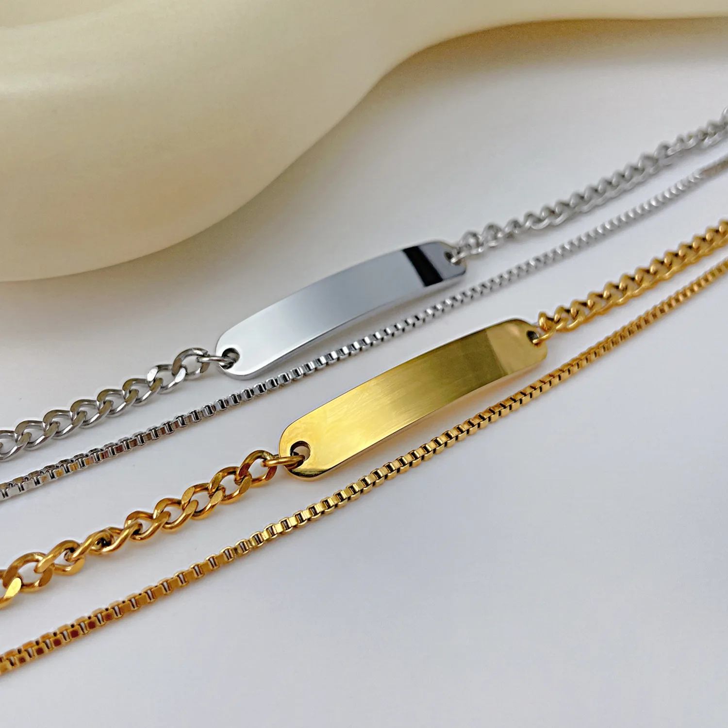 Fashionable titanium steel double chain bracelet, stainless steel long curved plate with customizable logo bracelet for women