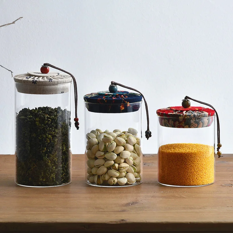 High quality fast delivery heat-resistant glass tea cabs candy storage jar food grade container borosilicate jars cloth cover