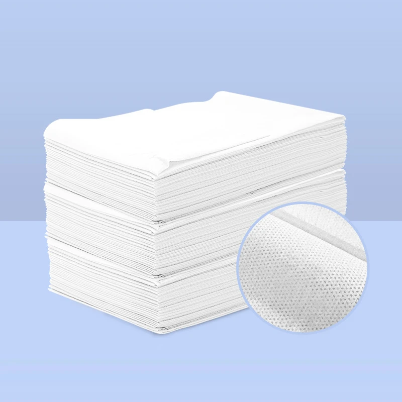 Fabric disposable nonwoven bed sheet roll