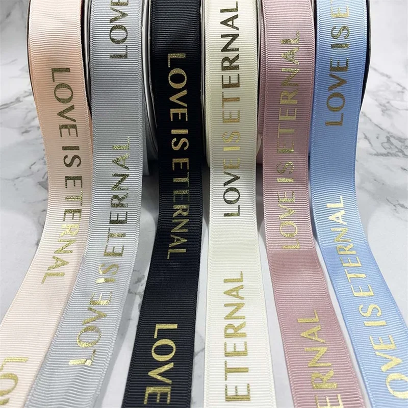 Factory wholesale double faced custom colors embossed printed black polyester satin ribbon with logo