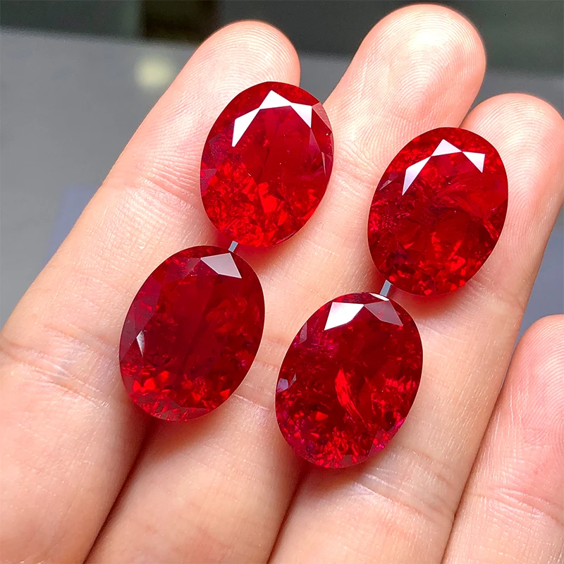 Oval shape natural cut red color synthetic ruby corundum including  minor cracks and inclusions lab created ruby loose stone