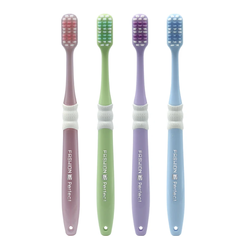 Factory wholesale custom logo shaped hole bristles plastic adult toothbrush