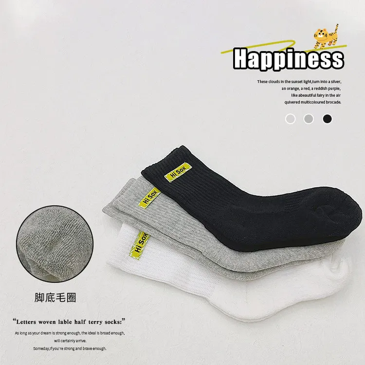 Hot selling cotton children long socks custom logo fashion comfortable school black white grey kids with phrases terry socks