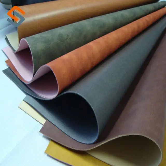 Hot Engraved Embossed Technology Pressure Change PU Leather for Jeans Label