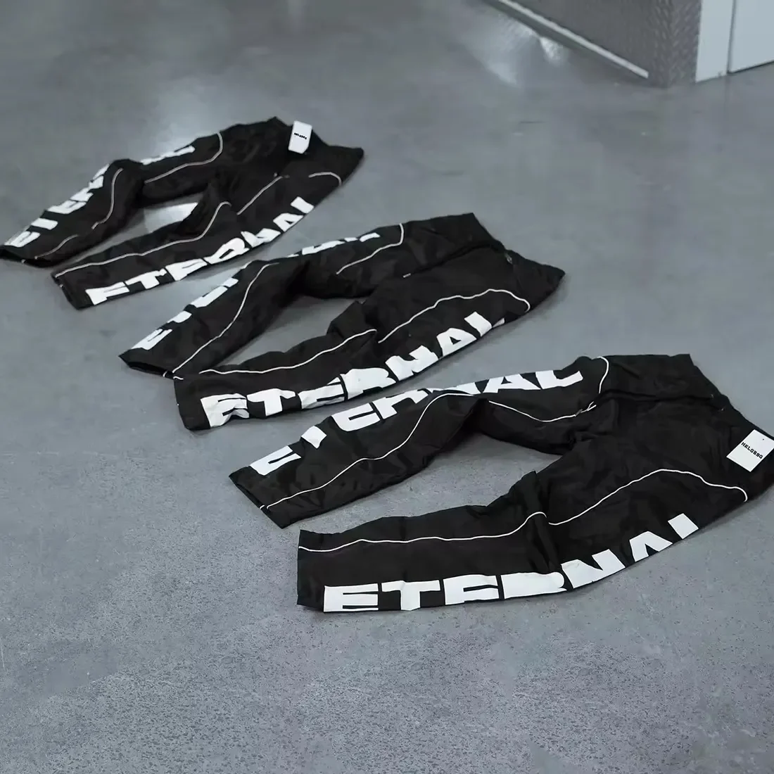 OEM Custom High Quality Sports Running Reflective Oversized Baggy Wide Leg Pants Track Pants Windbreaker  Nylon Pants For Men