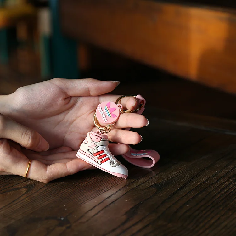 Wholesale Cartoon Creative Trend Ad Artificial Pendant Sports Sneakers Keychain Push Opening Small Gift