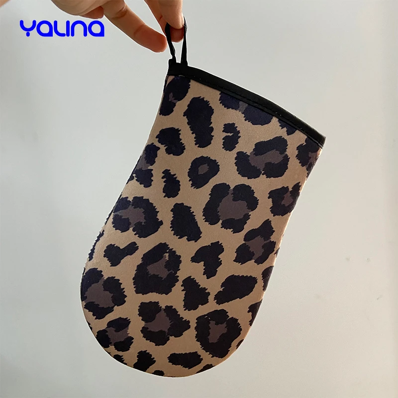 Reusable applicator glove evenly applies natural bronzed streak free appearance Leopard tanning mitt
