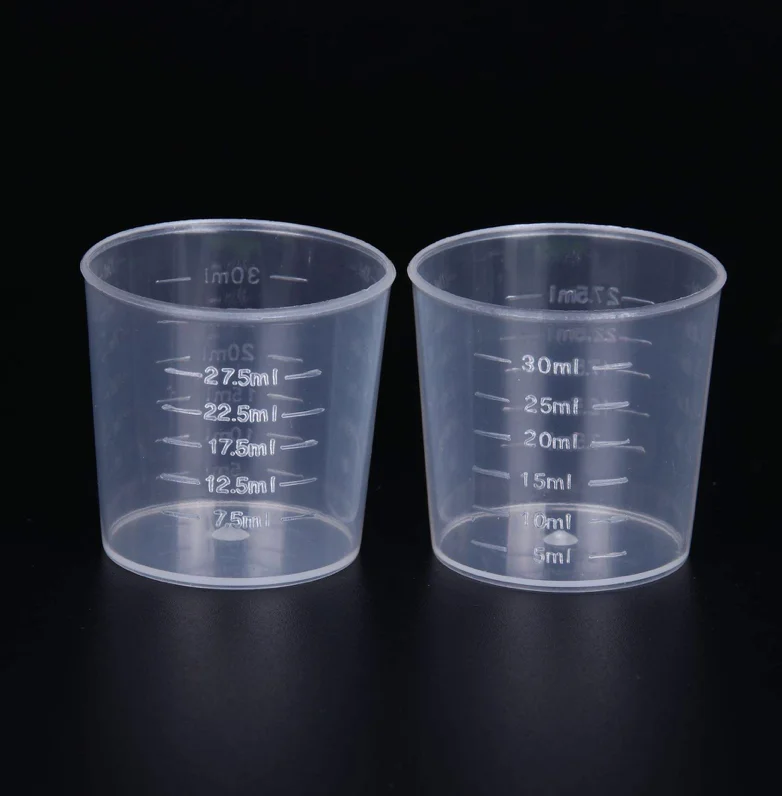 Graduated clear sterile plastic measuring disposable medicine cups