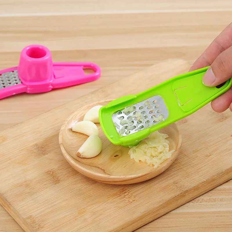 Explosive hot selling kitchen household garlic grinder creative multifunctional ginger grinder and garlic cutter wholesale