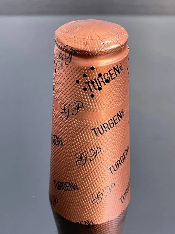 Decorative made of aluminum foil capsule for champagne