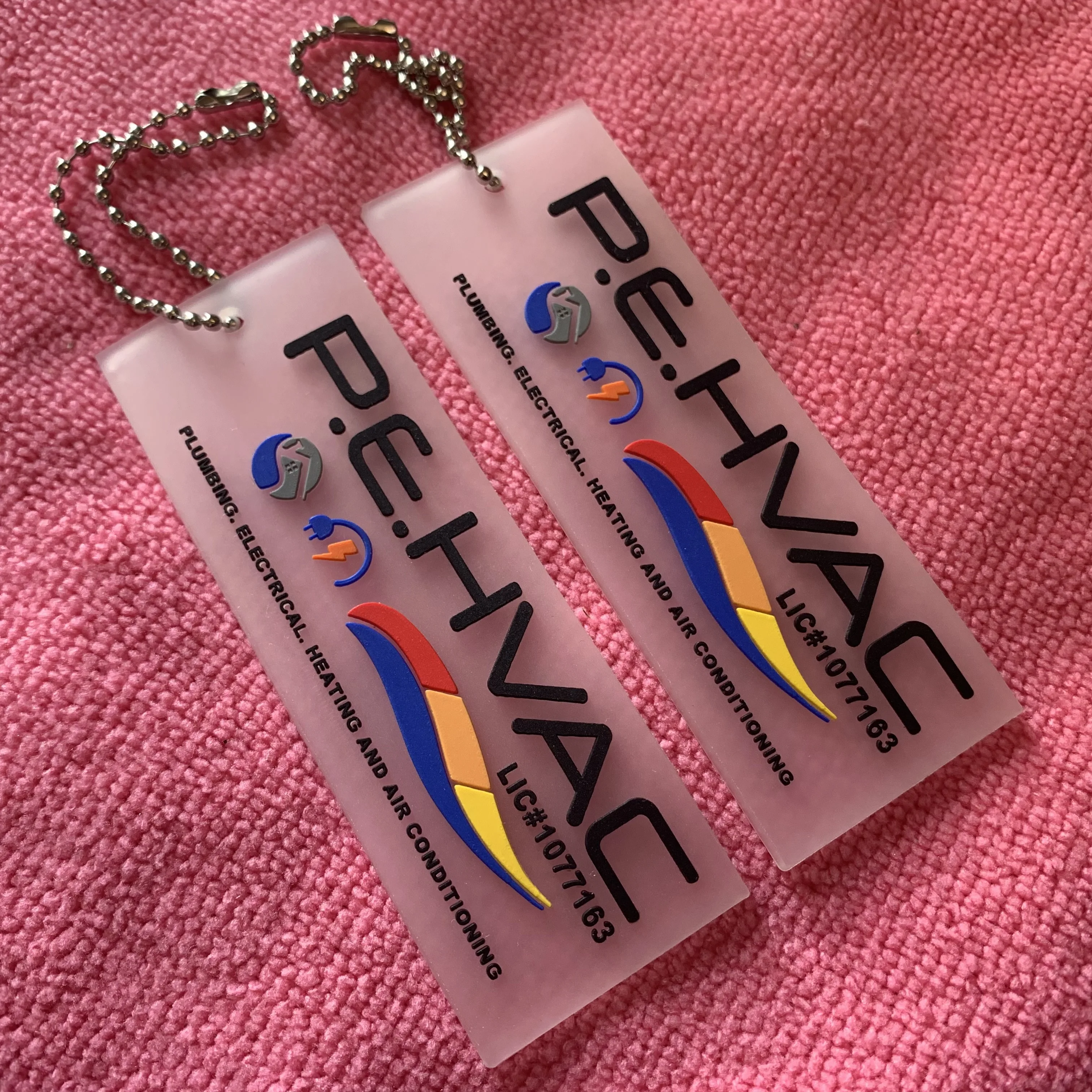 Best quality transparent PVC soft rubber hangtag,3D embossed letters clear PVC swing tag with metal ballchain