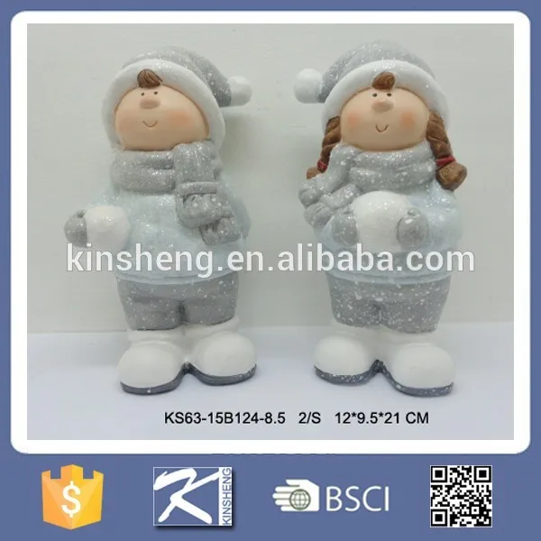 Christmas boy and girl ceramic figurines for sale