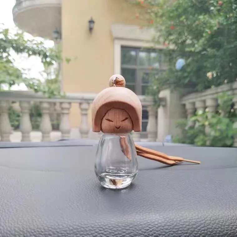 Factory wholesale high end cleardoll shaped empty car air freshener perfume glass bottle with wooden top