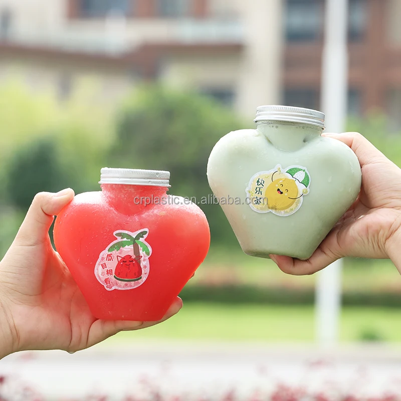Commercial wholesale 500ml Heart shaped customizable PET plastic juice bottle with aluminum cover