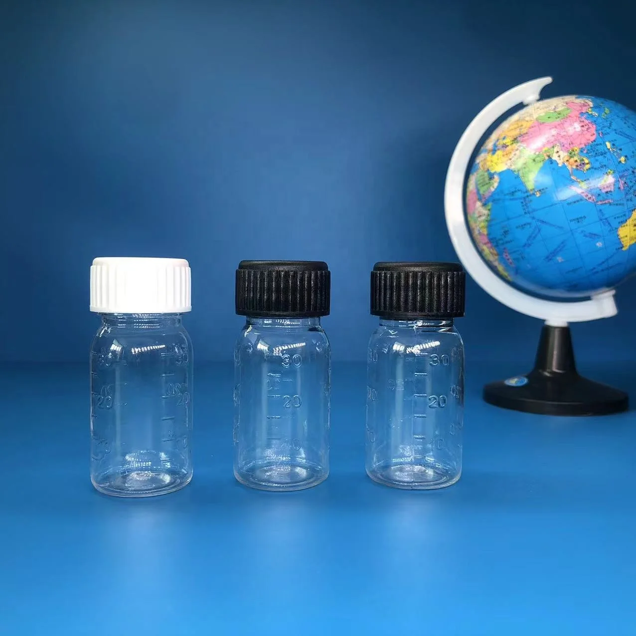China manufacturers 30ml pharmaceutical pet amber plastic bottles cough syrup bottle for liquid with screw cap