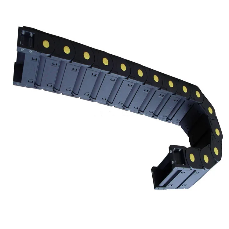 Enclosed Metal Cable and Hose Carriers protect cables on machine