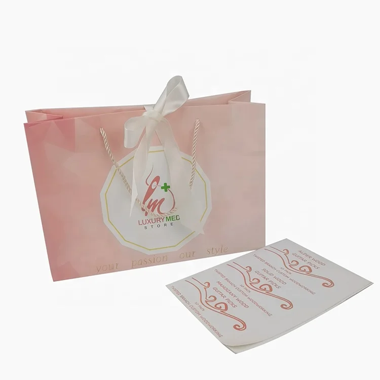 wholesale luxury pink cardboard wedding gift paper bags with handle gold ribbon