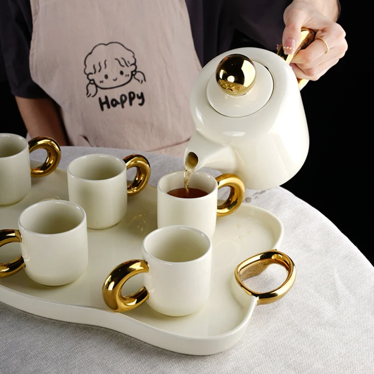 Modern nordic new design luxury gold and white ceramic set of cups tea pot and tray coffee and tea sets