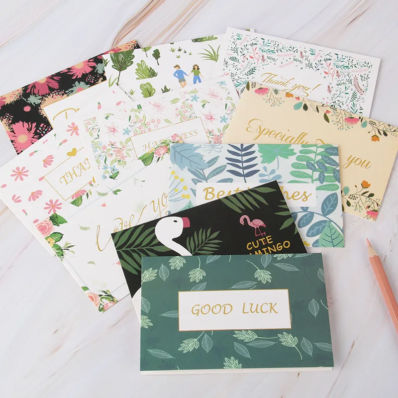 Customized flower thank-you cards with wild flowers, accompanied by envelopes. Floral blank greeting cards