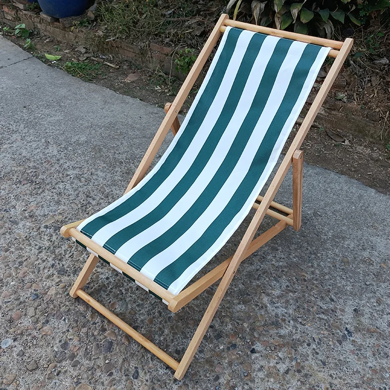 black and white stripe outside lazy rest beach hotel chaise lounge swimming pool wooden sun deck chair
