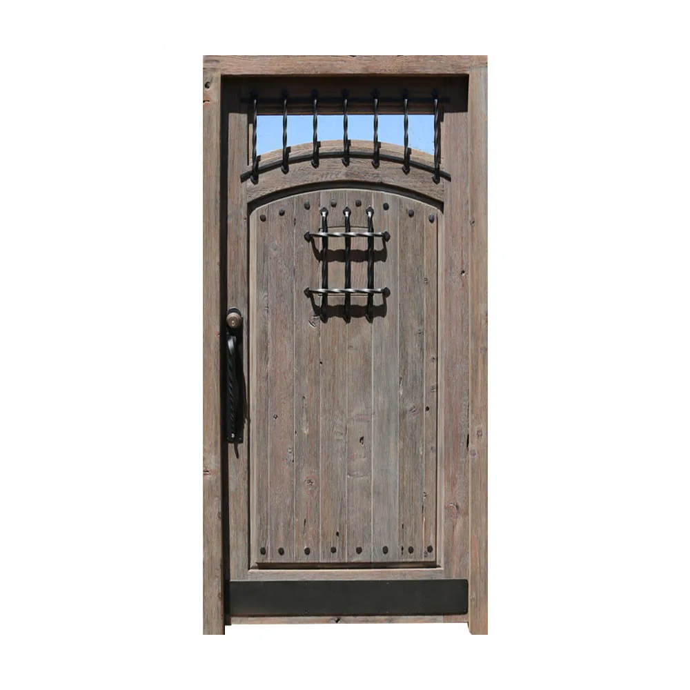 Traditional old castle wood door with wrought iron grill and clavos