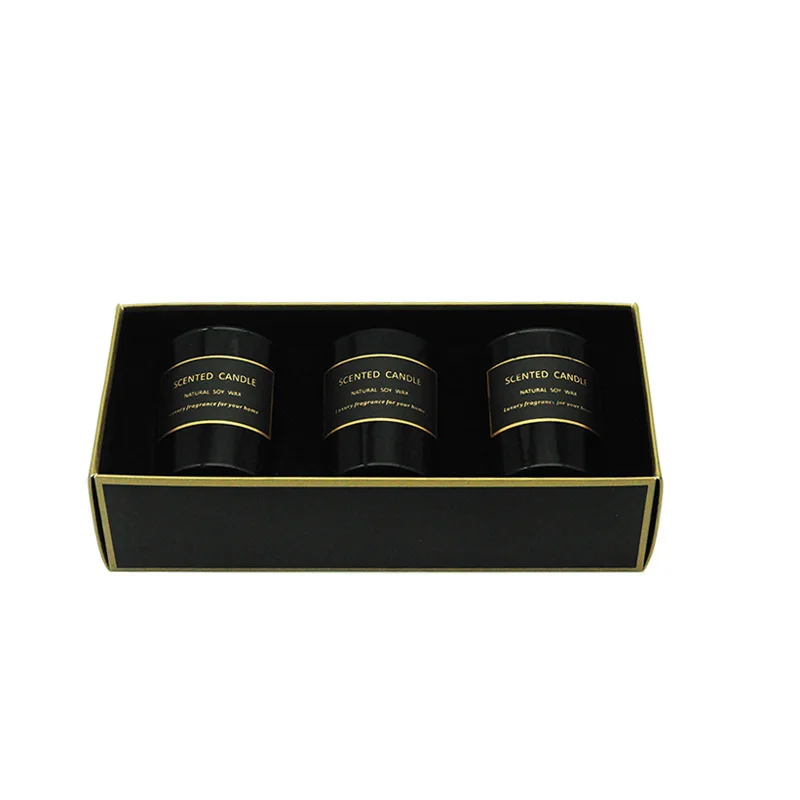 A three-piece black glass jar scented candle gift set