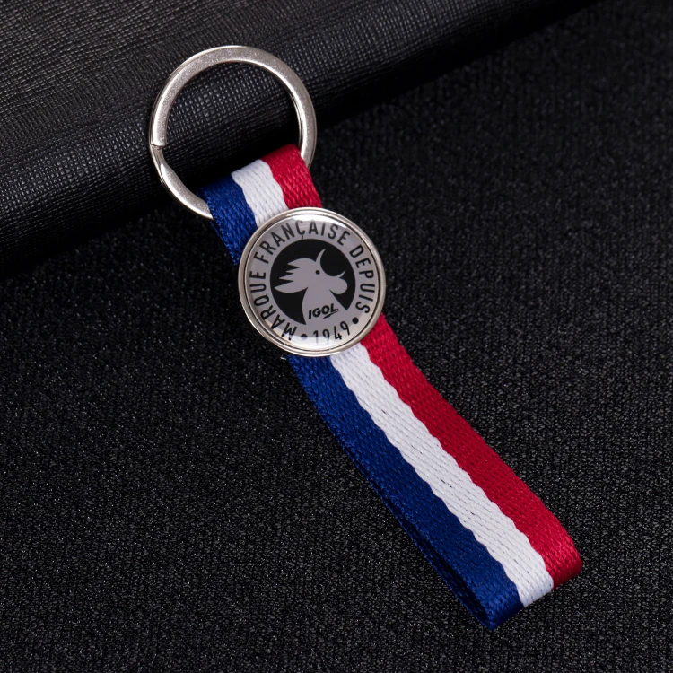 Hot Sale Twill Fabric Customized Own Trademark Merrow Border Flash Plain Embroidery Keychains for Clothing