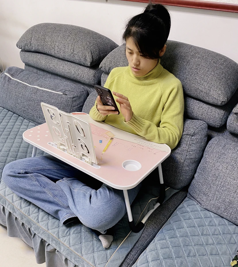 Portable and adjustable Mac laptop bed stand desk laptop desk suitable for home work travel and comes with a cup holder