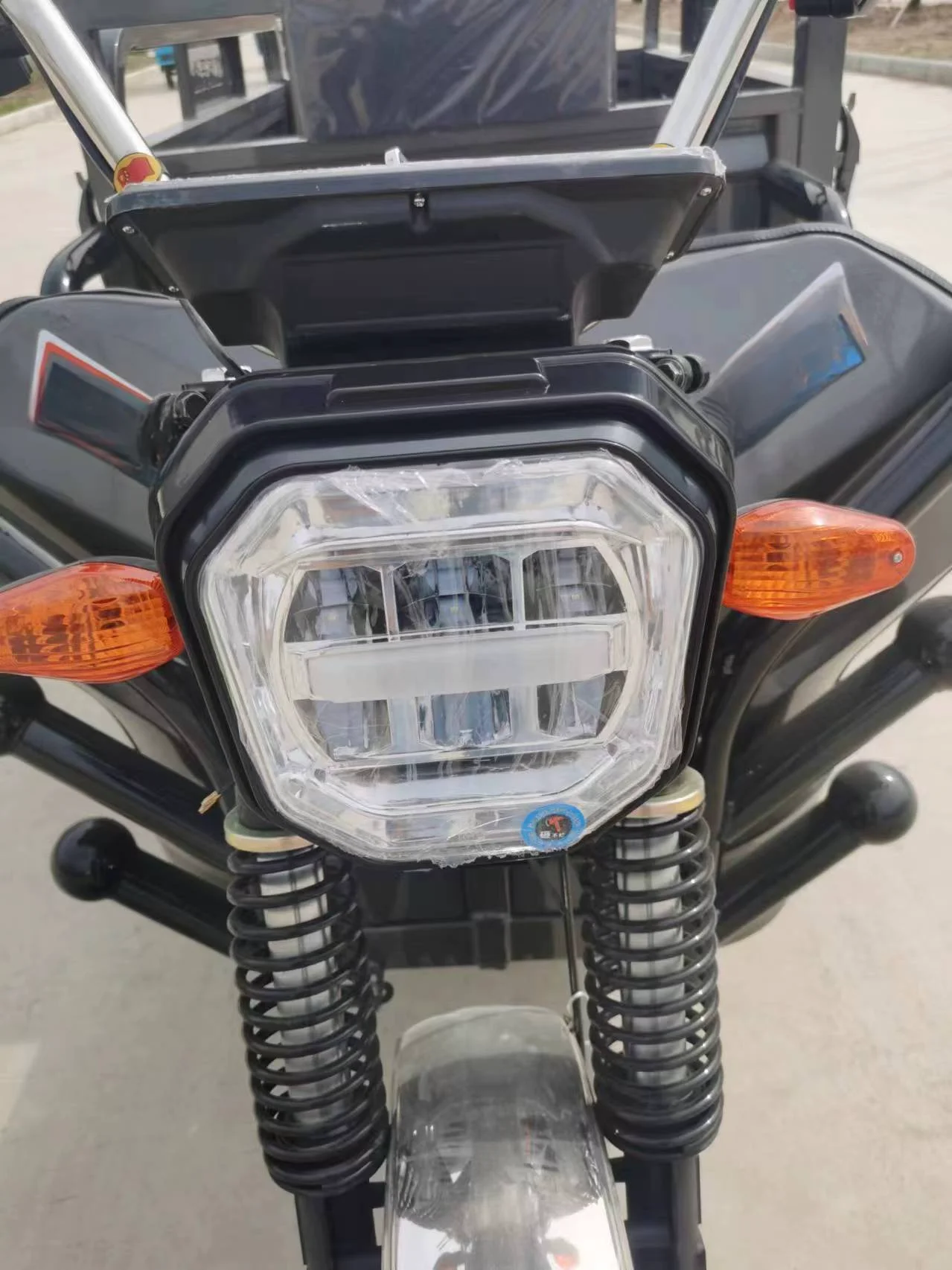 Two Chinese three wheeled electric freight vehicles electric tricycles tuk tuk tricycles delivery tricycles